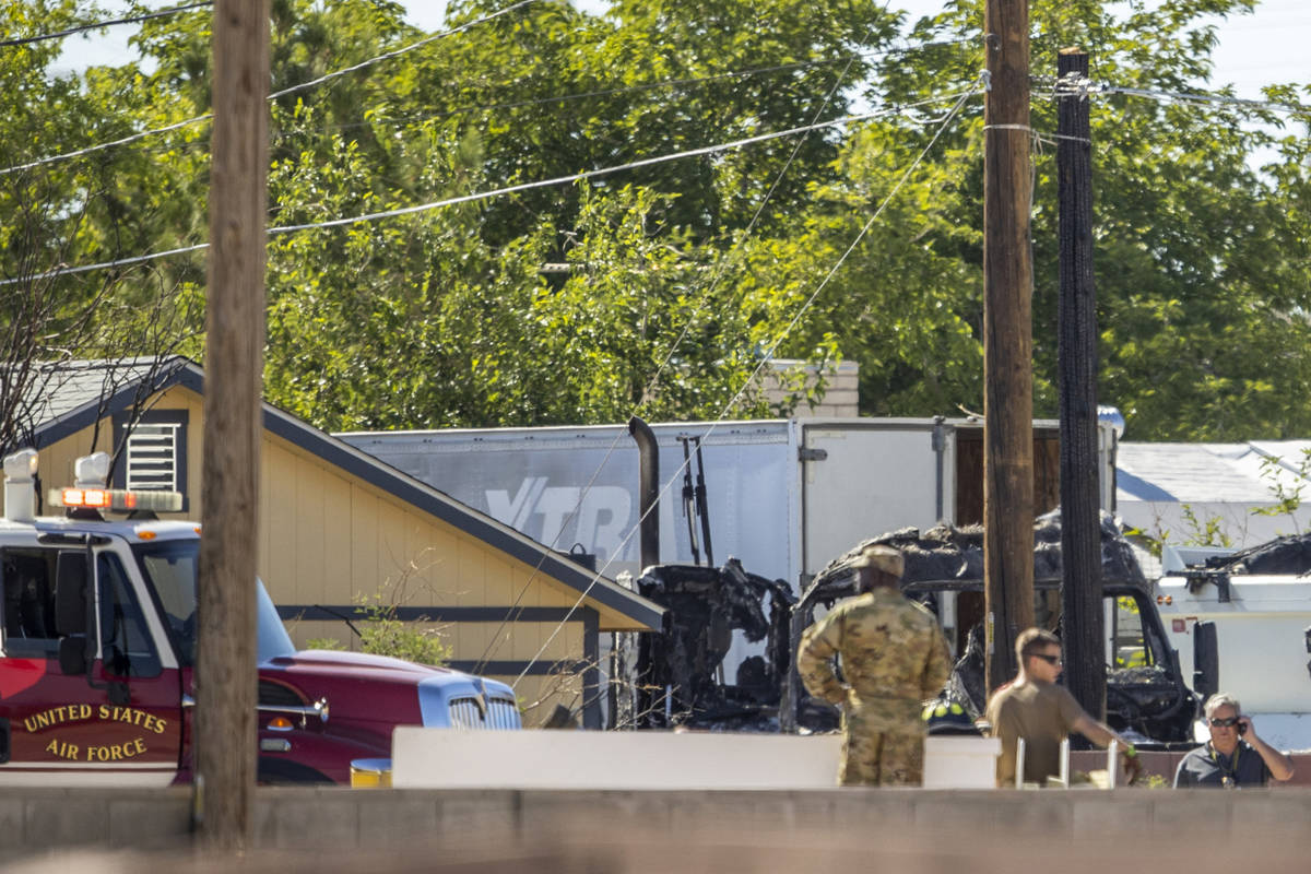 Military personnel investigate an airplane crash near Nellis Air Force Base on Monday, May 24, ...
