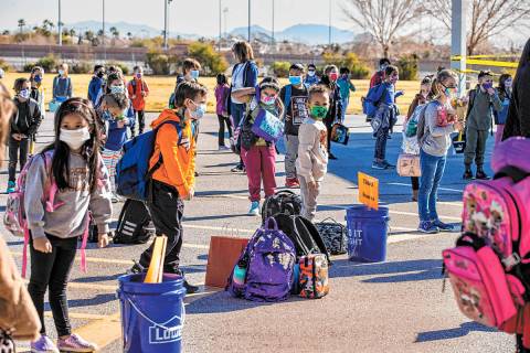 Students stand in lines on the playground assigned by their teachers at Goolsby Elementary Scho ...