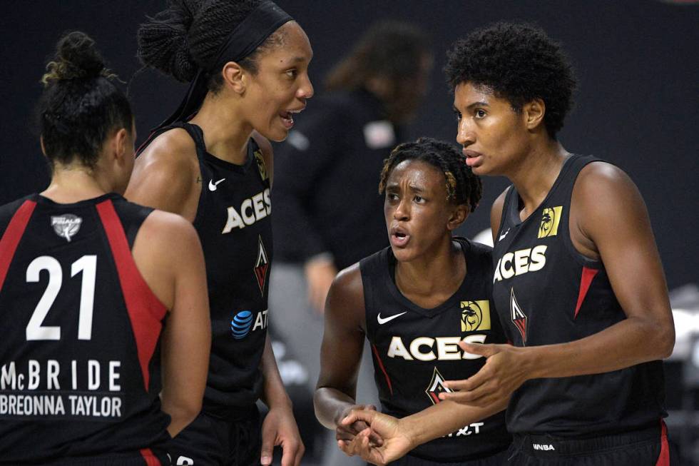 Las Vegas Aces guard Kayla McBride (21), center A'ja Wilson (22), guard Danielle Robinson, seco ...