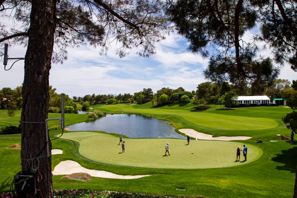 Ryann OÕToole, second from right, gets ready to putt on the 18th green during the practice ...