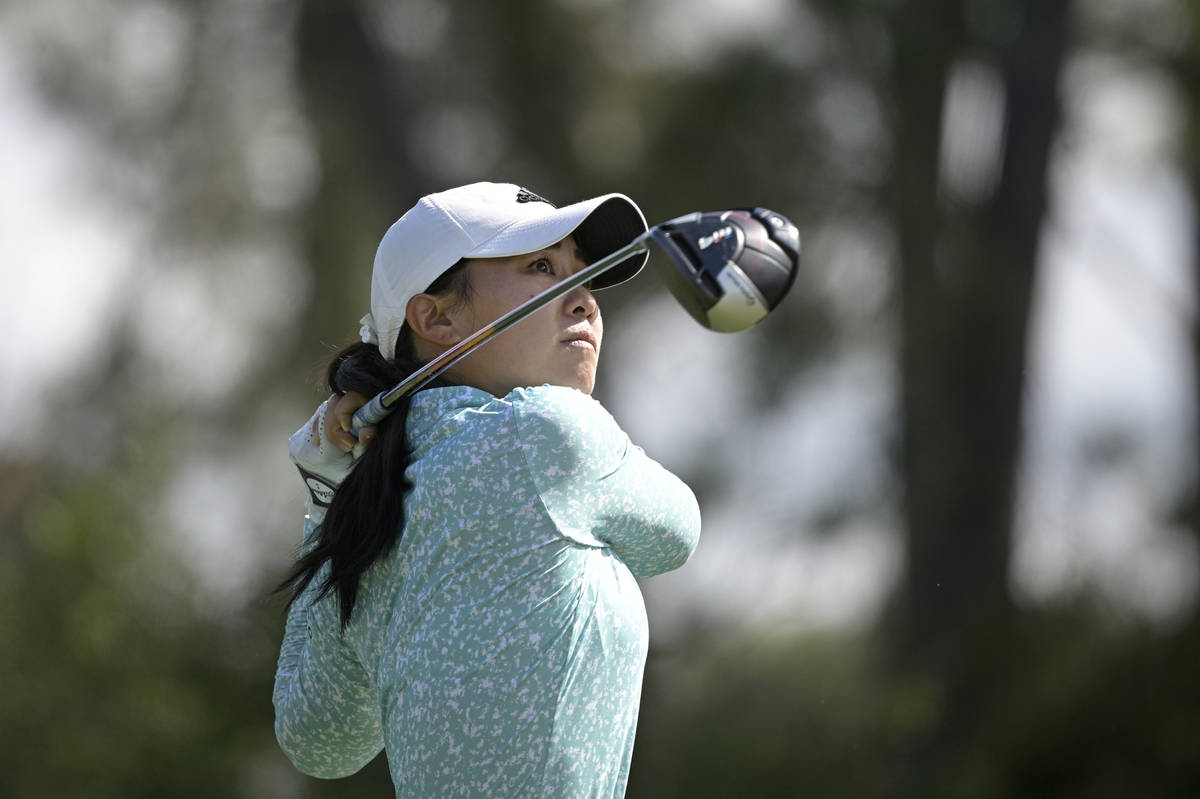 Danielle Kang watches after hitting her tee shot on the seventh hole during the final round of ...