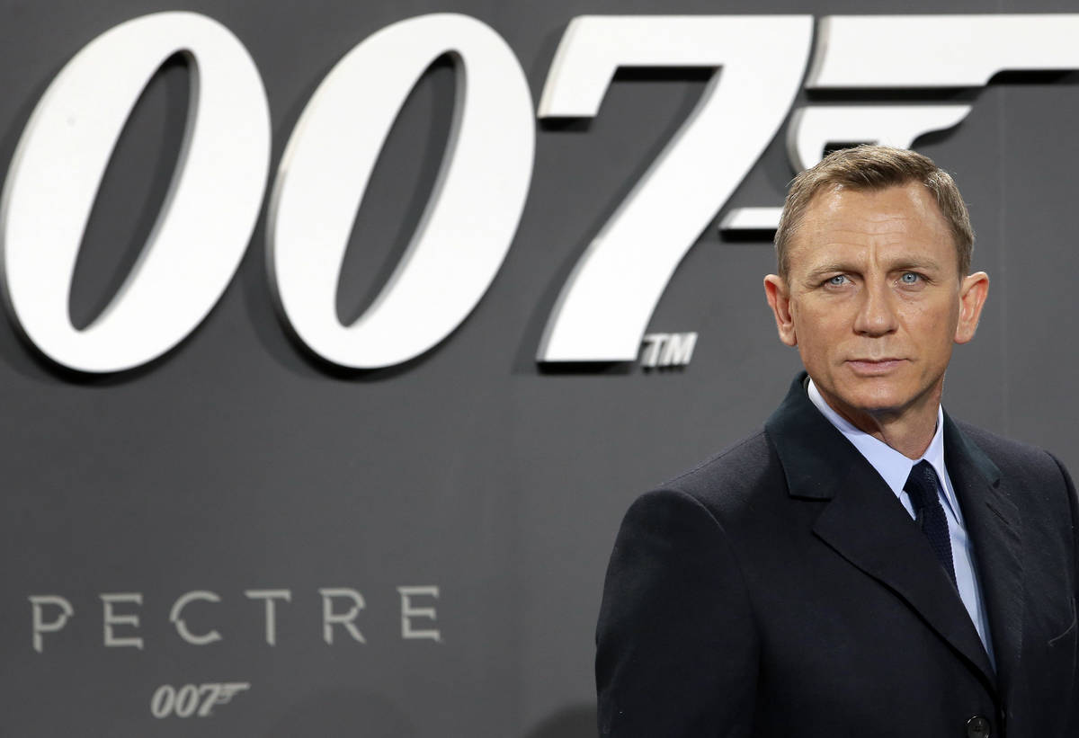 In this Oct. 28, 2015, file photo, actor Daniel Craig poses for the media as he arrives for the ...