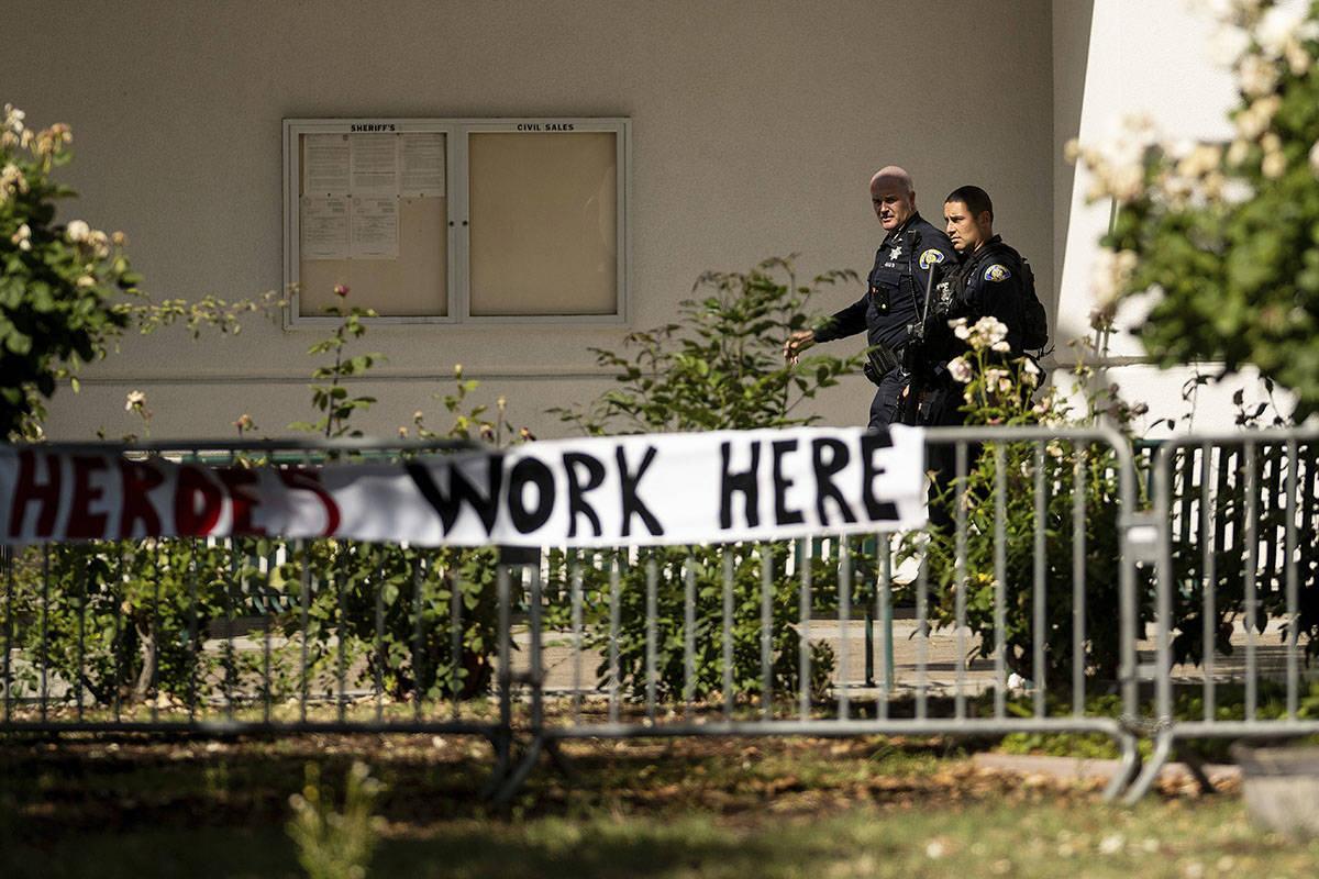 Police officers respond near the scene of a shooting at a Santa Clara Valley Transportation Aut ...