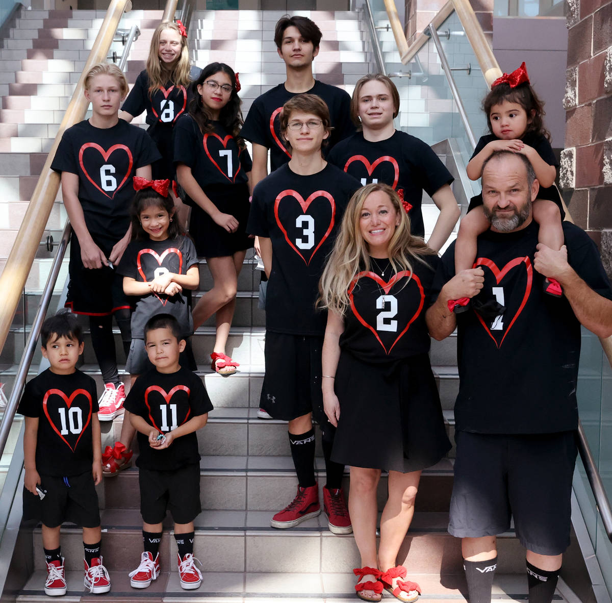 Heath and Aimee Hairr pose for pictures with their kids in Clark County Family Court in Las Veg ...