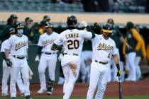 Oakland Athletics' Matt Chapman, left, celebrates with Matt Olson after the Athletics defeated ...