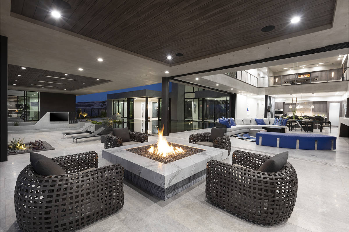 The patio off the living room has a fire pit. (Synergy Sotheby’s International Realty)