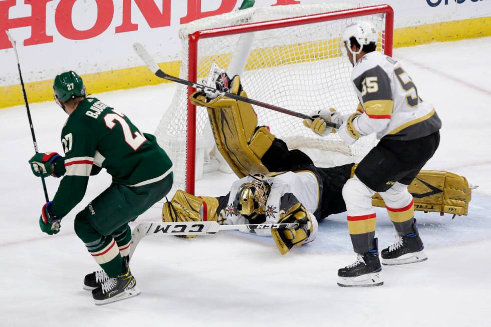 Minnesota Wild center Nick Bjugstad (27) scores a goal on Vegas Golden Knights goaltender Marc- ...