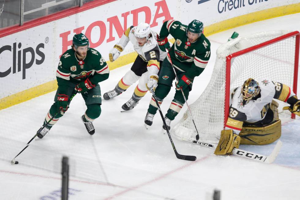 Minnesota Wild right wing Ryan Hartman (38) controls the puck in front of Vegas Golden Knights ...