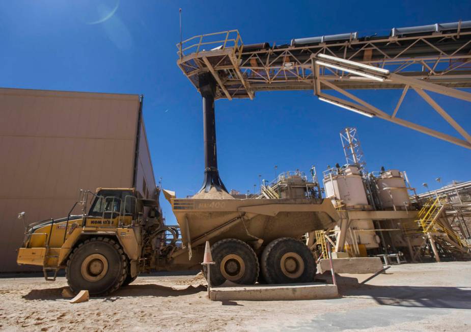 Rare earth concentrate pours onto a truck at Las Vegas-based company MP Materials on Thursday, ...