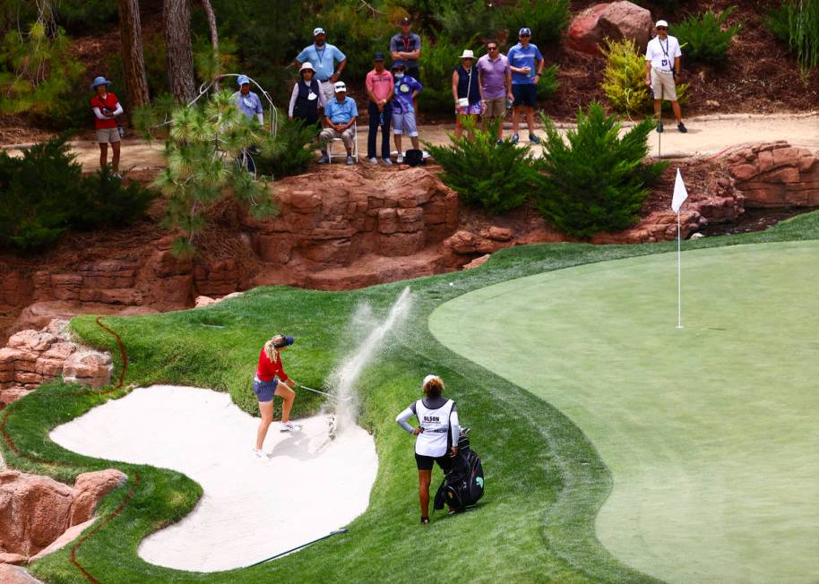 Amy Olson hits out from a bunker on the 17th hole during the first round of the Bank of Hope LP ...