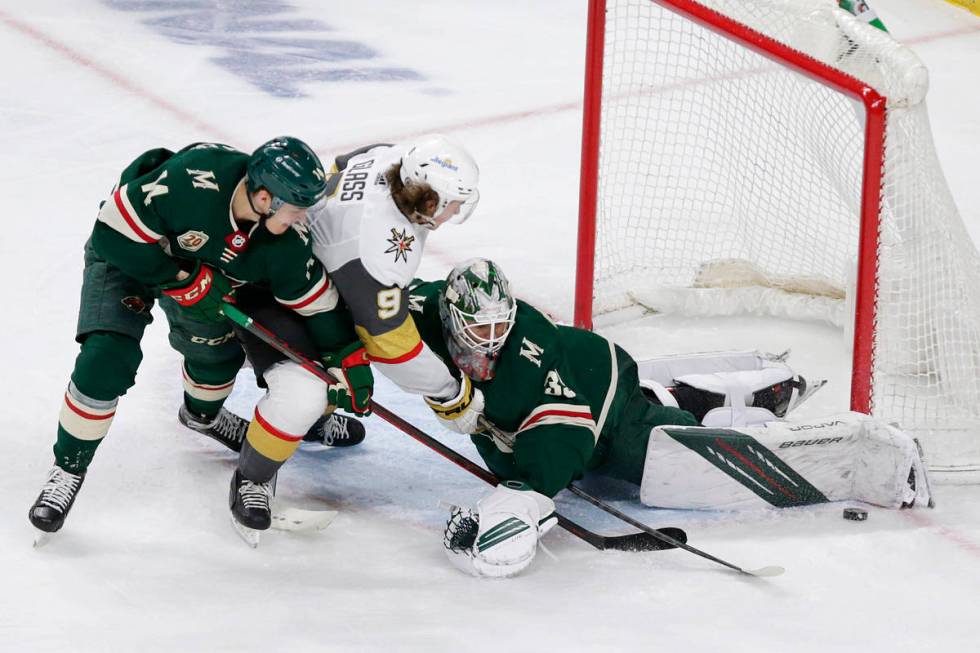 Minnesota Wild goaltender Cam Talbot (33) makes a save on Vegas Golden Knights center Cody Glas ...