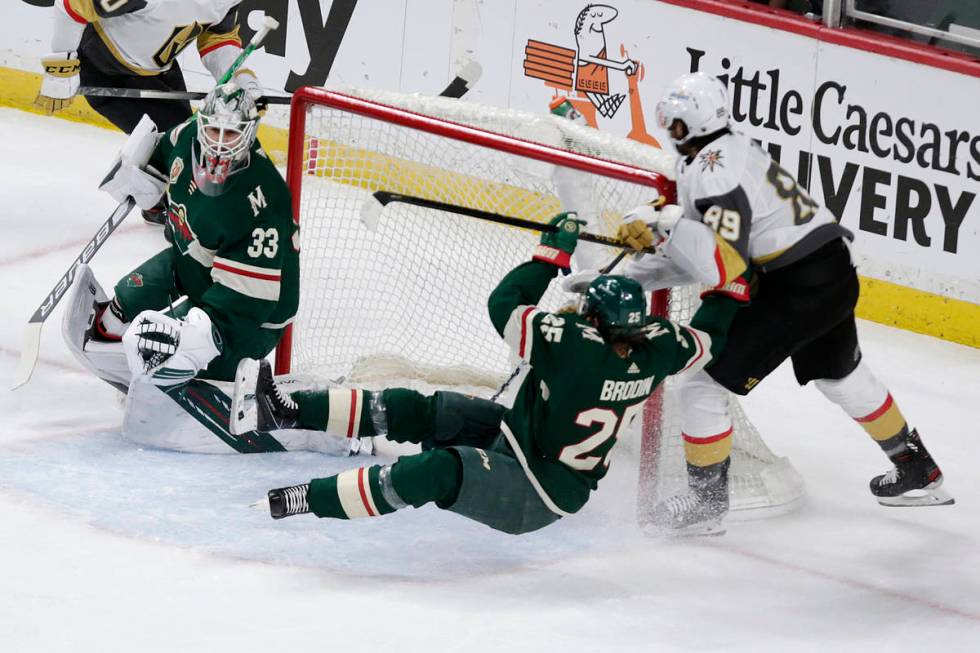 Minnesota Wild defenseman Jonas Brodin (25) is hit by Vegas Golden Knights right wing Alex Tuch ...