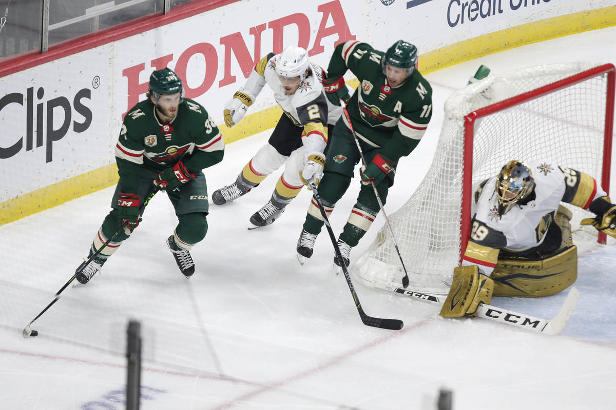 Minnesota Wild right wing Ryan Hartman (38) controls the puck in front of Vegas Golden Knights ...