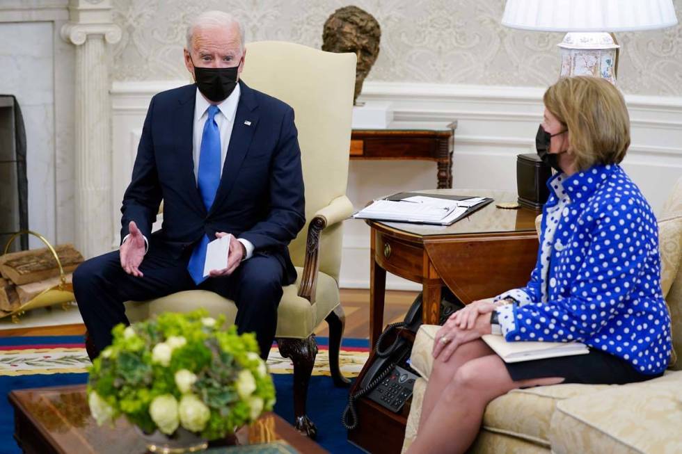 In this May 13, 2021, file photo, Sen. Shelley Moore Capito, R-W.Va., right, listens as Preside ...