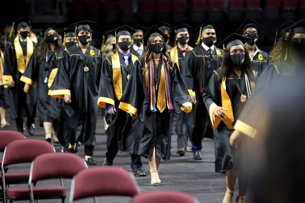 Clark High School students, including Sofia Bermudez, center, file in during a graduation cerem ...