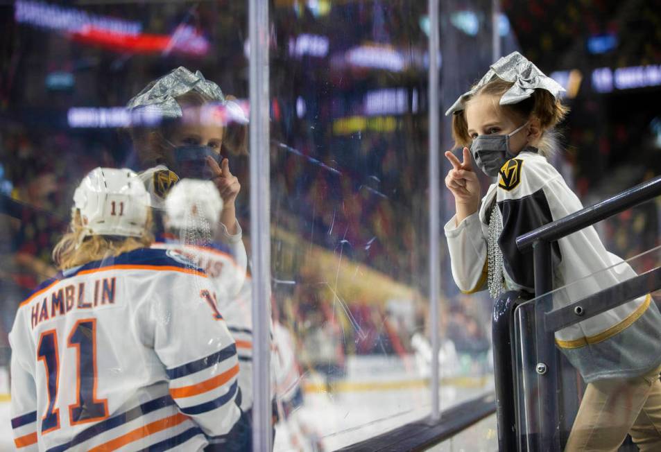 Henderson Silver Knights fan Emmalynne Patterson, right, lets Bakersfield Condors players know ...