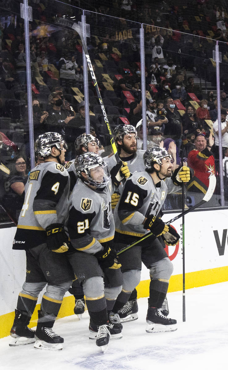 Henderson Silver Knights defensemen Jimmy Schuldt (4), Henderson Silver Knights left wing Danny ...