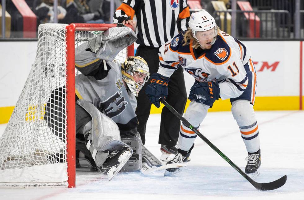 Henderson Silver Knights goaltender Logan Thompson (36) collides with Bakersfield Condors left ...