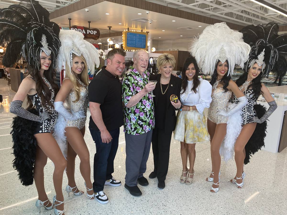 Stephen and Judi Siegel are shown with Oscar and Carolyn Goodman, along with the ZB Showgirls, ...