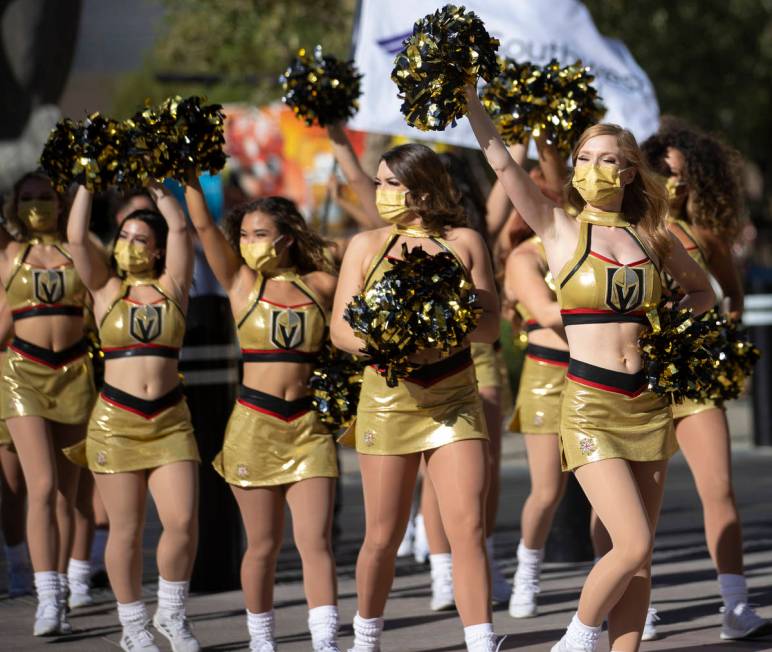 The Golden Aces cheerleaders fire up the crowd outside T-Mobile Arena before the start of Game ...