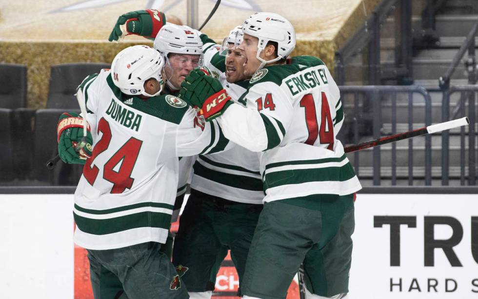 Minnesota Wild defenseman Matt Dumba (24) and Minnesota Wild center Joel Eriksson Ek (14) celeb ...