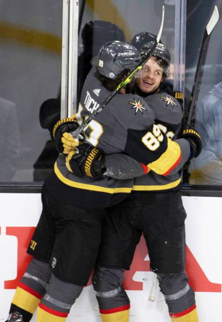 Vegas Golden Knights right wing Alex Tuch (89) celebrates with Vegas Golden Knights center Matt ...