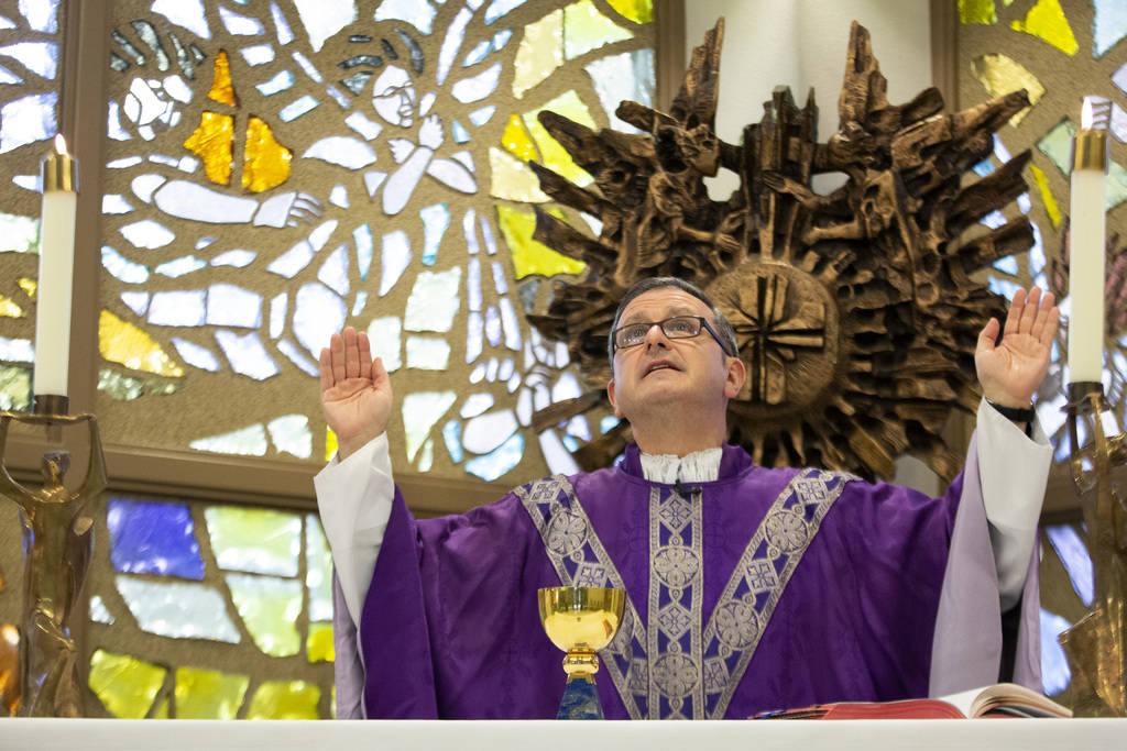Monsignor Gregory Gordon celebrates a virtual Mass at the the Roman Catholic Diocese of Las Veg ...