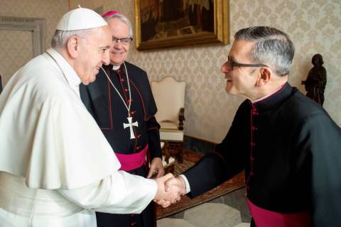 Monsignor Gregory Gordon, right, is seen in a January 2020 photo with Pope Francis, left, and L ...