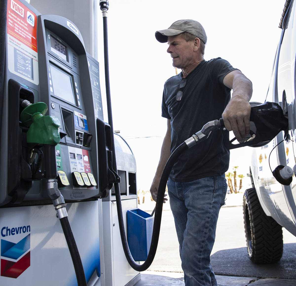 Charles Hutchinson of Henderson pumps gas at Chevron on Tropicana Avenue, on Wednesday, April 2 ...
