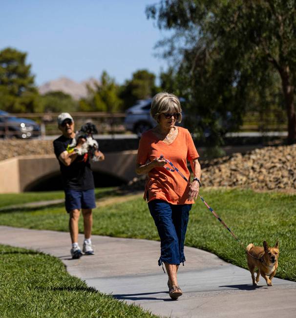 Carol Liberty walks her dog, Mikey, in Sun City Summerlin on Friday, May 28, 2021. (Chase Steve ...