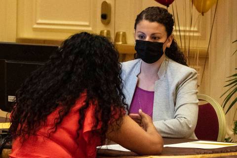 A newly hired employee discusses with Laura Hermosillo, right, a talent acquisition for the Ven ...