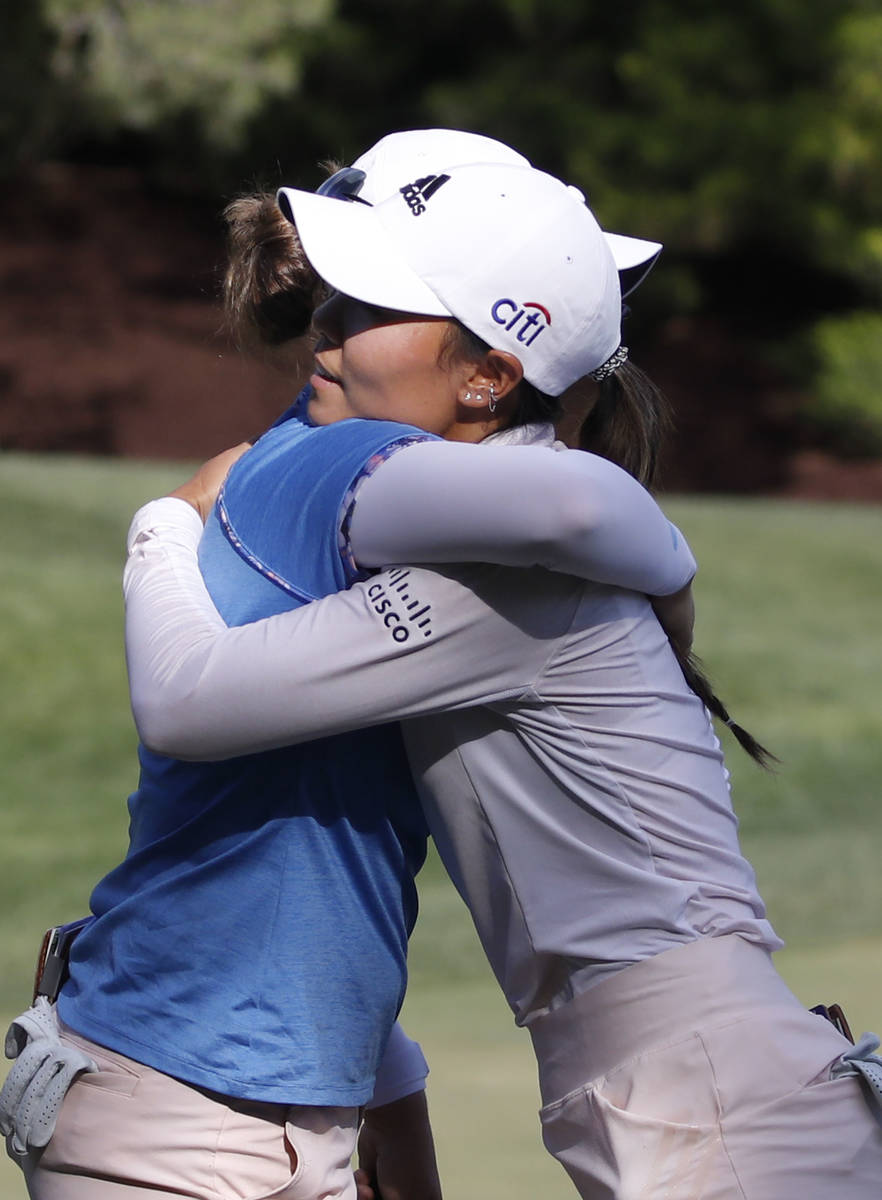 Danielle Kang, right, hugs Ally Ewing after finishing on the 18th hole during the quarter final ...