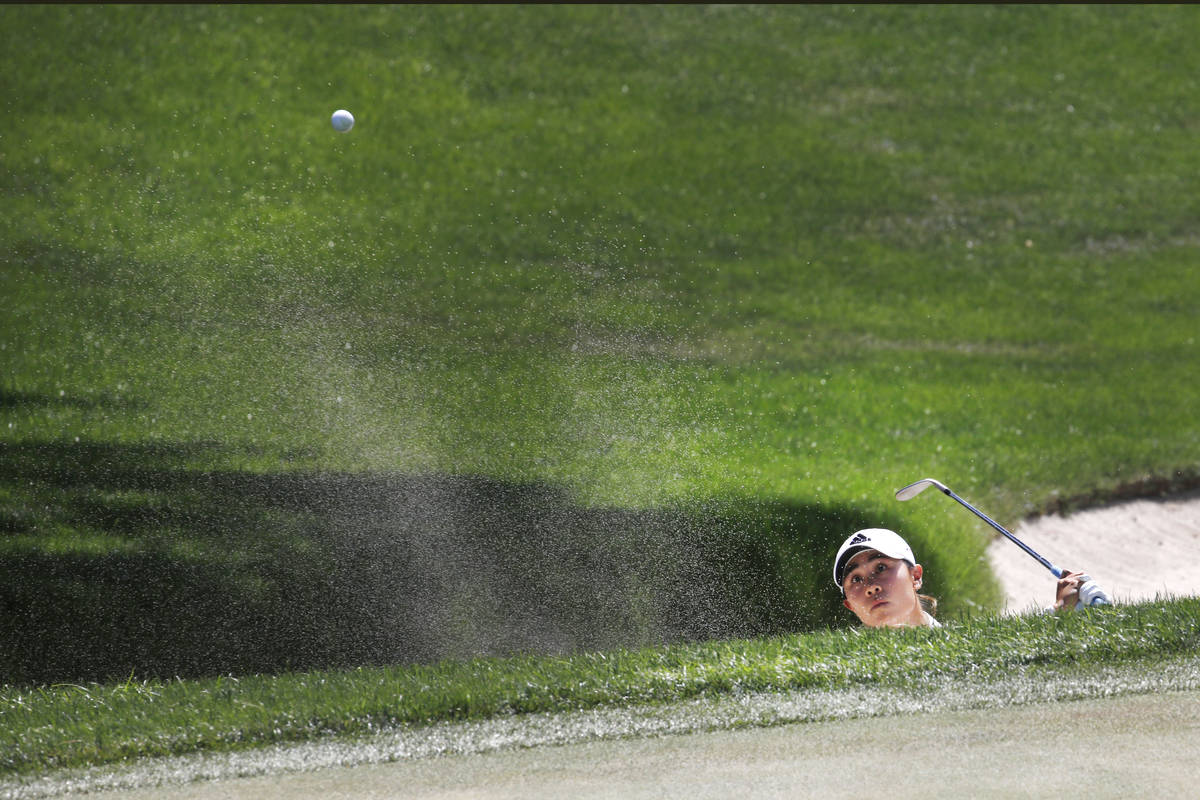 Danielle Kang hits out of a bunker on the 10th hole during the quarter final round of the Bank ...