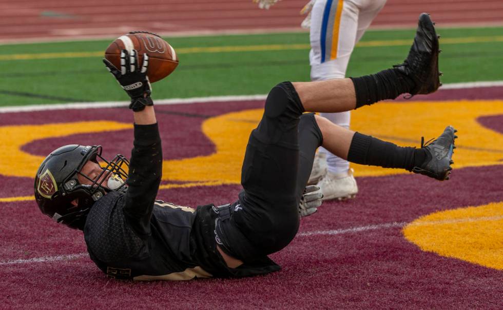 Faith LutheranÕs Landon Wrzesinski (10) celebrates a touchdown catch over Moapa Valley dur ...