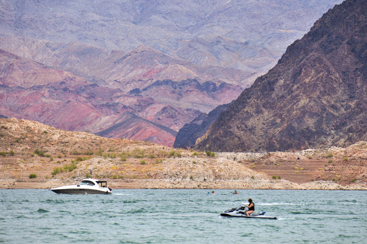 Boater hang out on the water near the mountains at Lake Mead Recreation Area on Saturday, May 2 ...