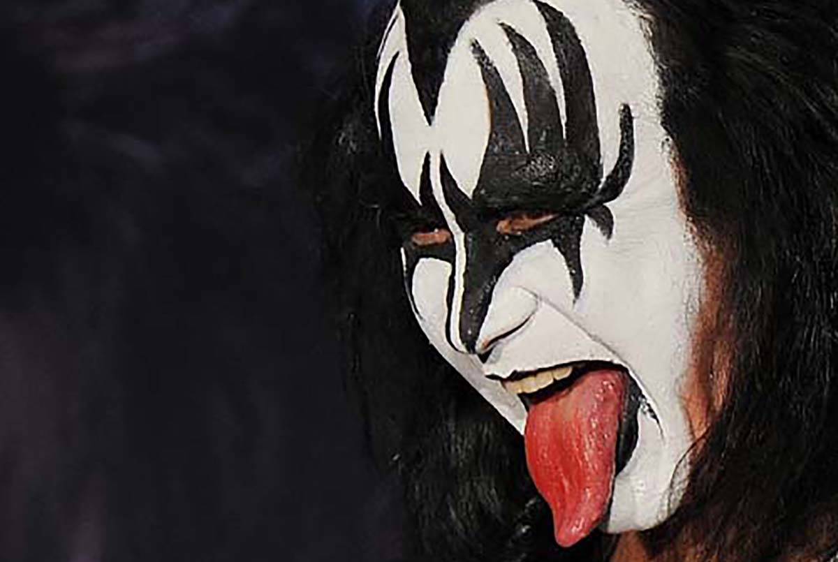 Gene Simmons poses for pictures at Motley Crue and Kiss the 2012 Mega Tour news conference, Tue ...