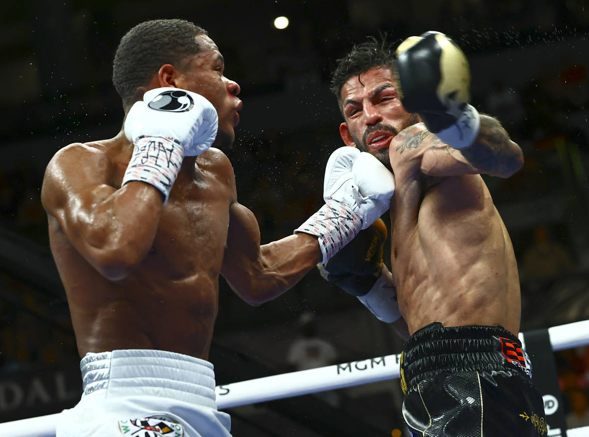 Devin Haney, left, punches Jorge Linares during the WBC lightweight title boxing match Saturday ...