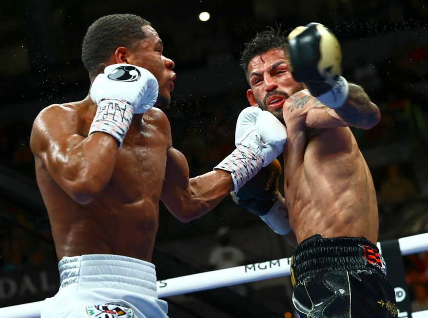 Devin Haney, left, punches Jorge Linares during the WBC lightweight title boxing match Saturday ...