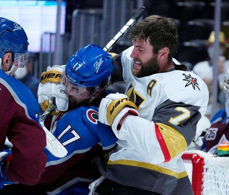 Vegas Golden Knights defenseman Alex Pietrangelo (7) fights with Colorado Avalanche center Tyso ...