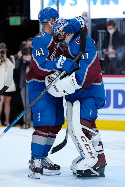 Colorado Avalanche center Pierre-Edouard Bellemare (41) and goaltender Philipp Grubauer (31) ce ...