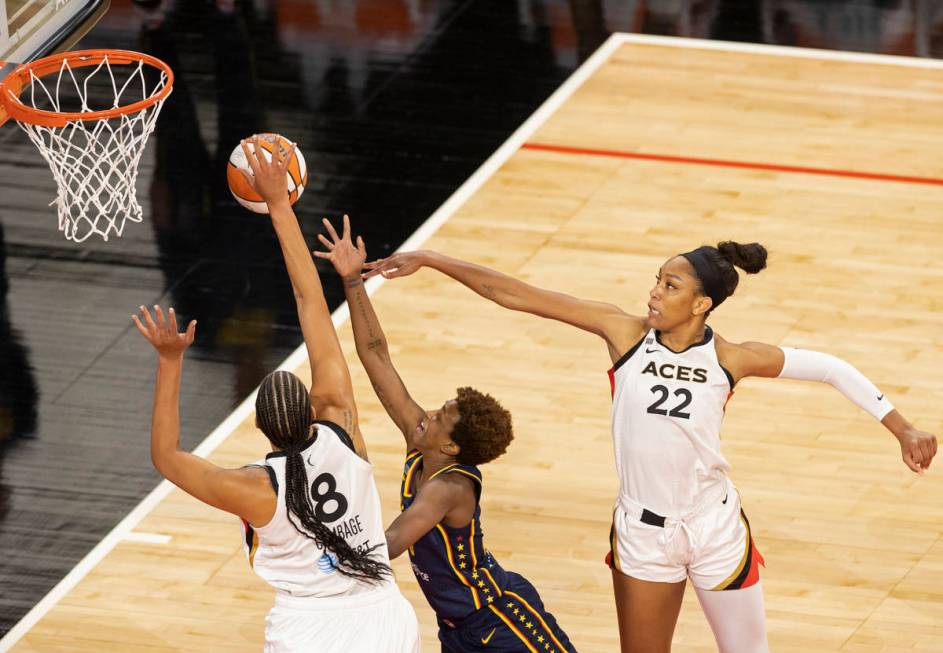 Las Vegas Aces center Liz Cambage (8) and Las Vegas Aces forward A'ja Wilson (22) defend the dr ...