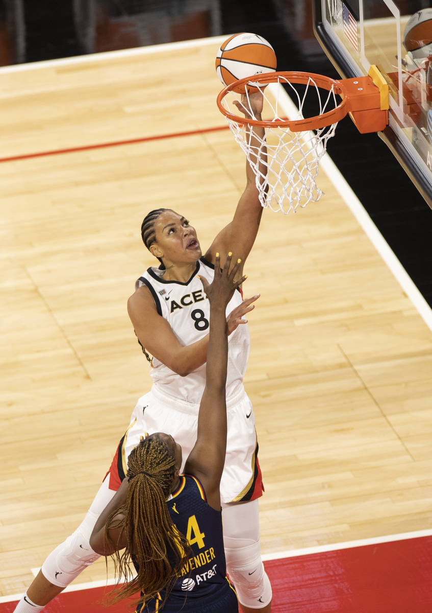 Las Vegas Aces guard Riquna Williams (2) shoots over Indiana Fever guard Kelsey Mitchell (0) in ...