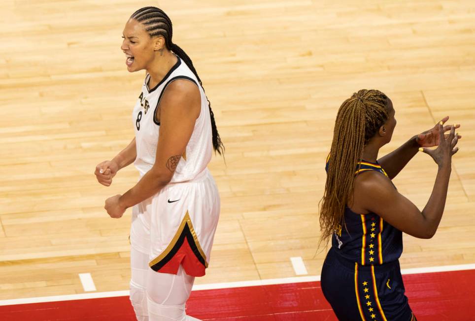 Las Vegas Aces center Liz Cambage (8) celebrates in front of Indiana Fever forward Jantel Laven ...