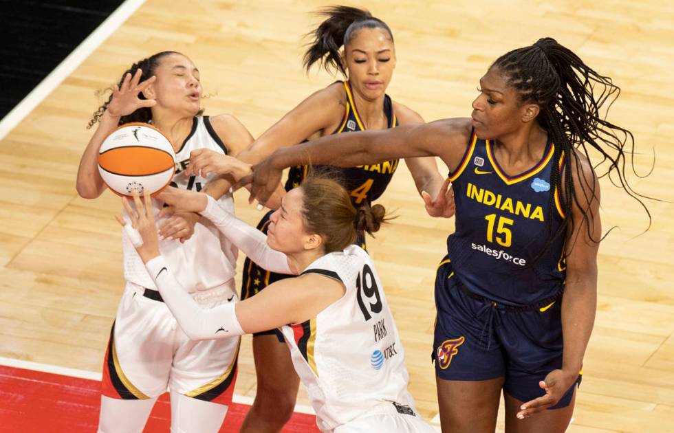 Las Vegas Aces center JiSu Park (19) is fouled by Indiana Fever forward Teaira McCowan (15) in ...