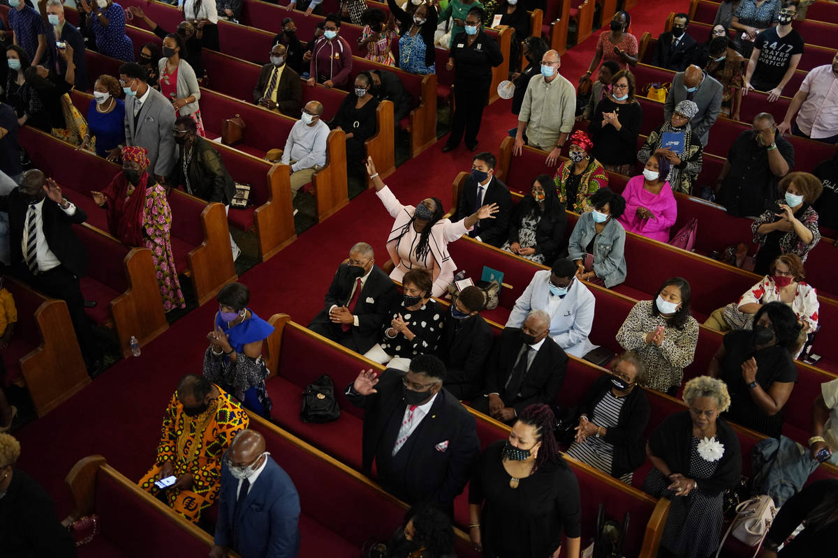 People attend a joint service for the centennial of the Tulsa Race Massacre at First Baptist Ch ...