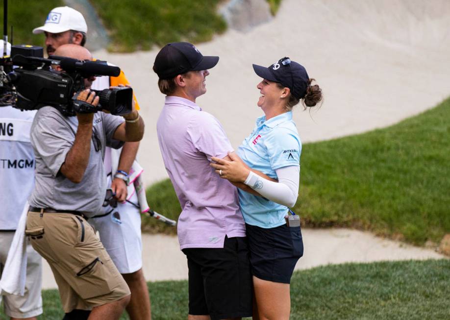 Ally Ewing celebrates with her husband,ÊCharlie Ewing, after winning the championship roun ...