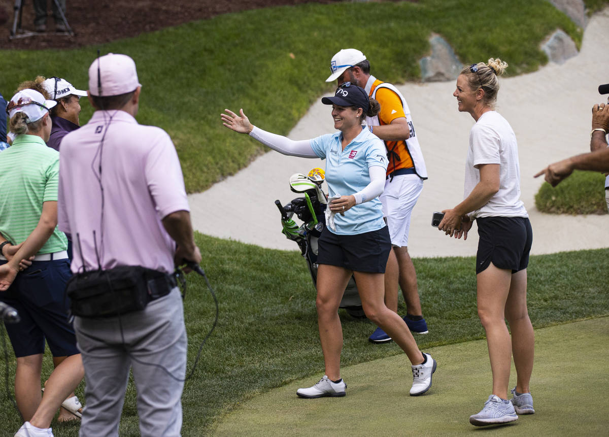 Ally Ewing celebrates with friends, including fellow golfer Amy Olson, right, after winning the ...