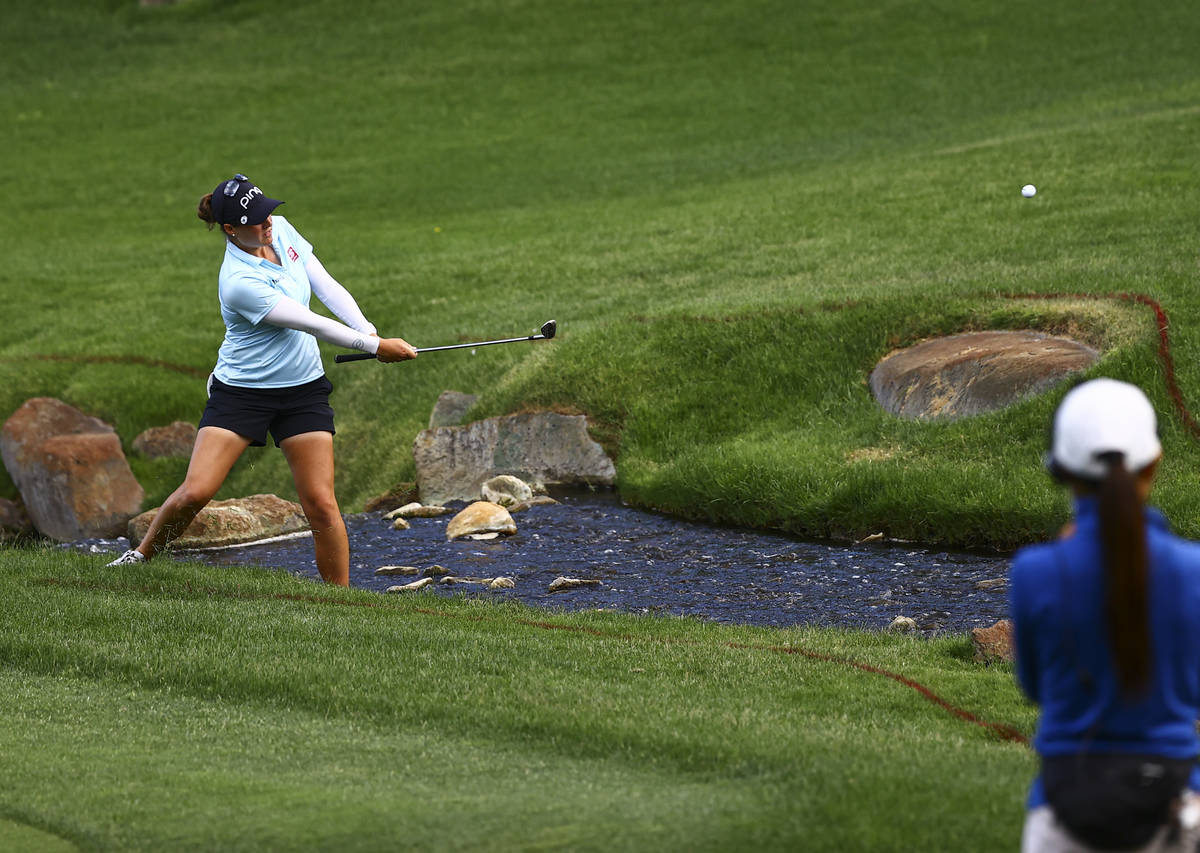 Ally Ewing hits her shot out of the rough at the 15th hole during the championship round of the ...
