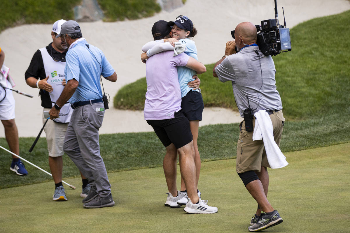 Ally Ewing celebrates with her husband, Charlie Ewing, after winning the championship round of ...