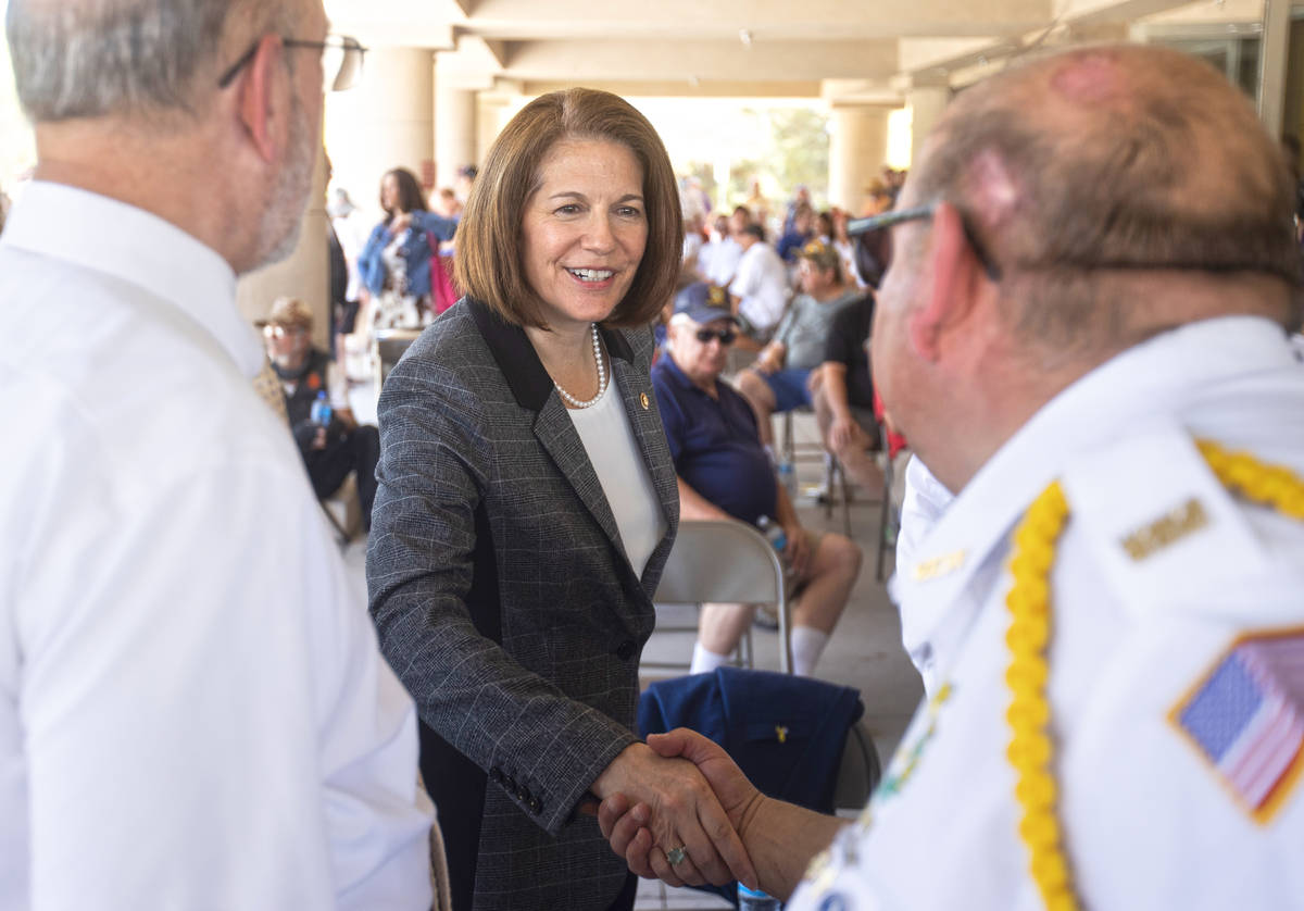 Sen. Catherine Cortez Masto, D-Nev., middle, shakes hands with veterans during a Memorial Day c ...